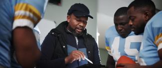 football players and their coach