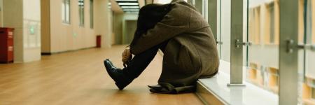 woman sitting with her head down